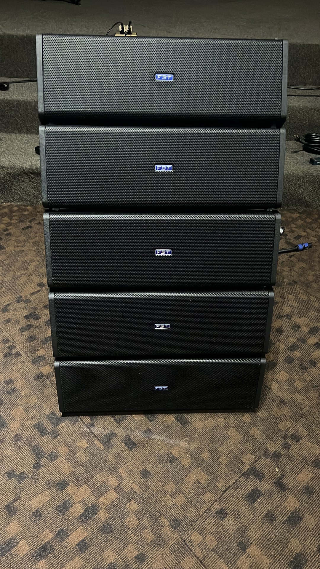 Stack of FBT Mitus 206 line-array speaker cabinets