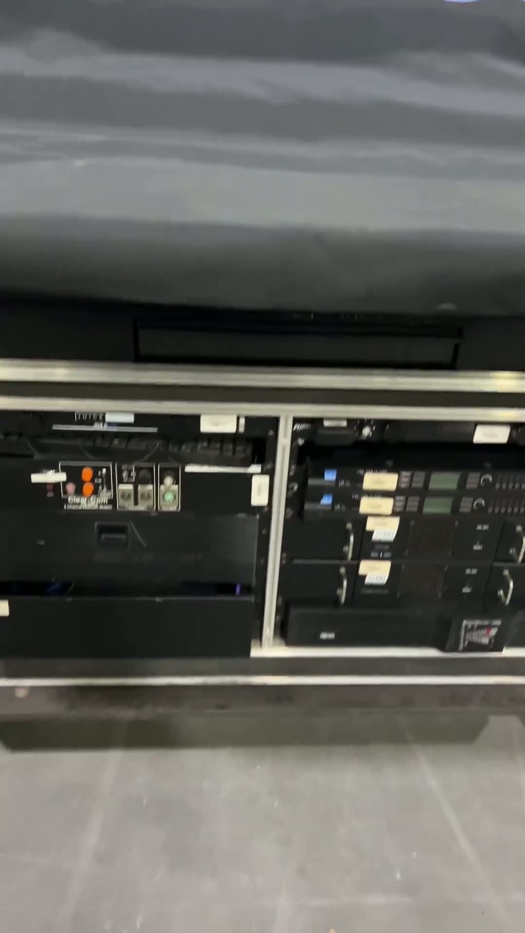 Amplifier and wireless comms racks in touring road cases backstage